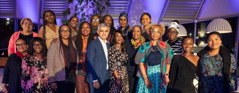 Mayor Sadiq Khan with group of about 20 speakers and guests at Saluting our Sisters Black History Month event at City Hall on 17 October 