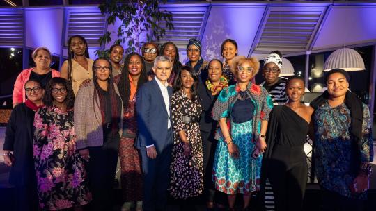 Mayor Sadiq Khan with group of about 20 speakers and guests at Saluting our Sisters Black History Month event at City Hall on 17 October 