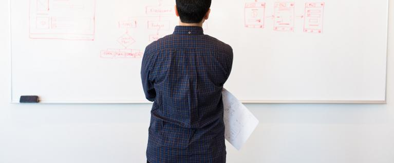 Man standing in front of whiteboard
