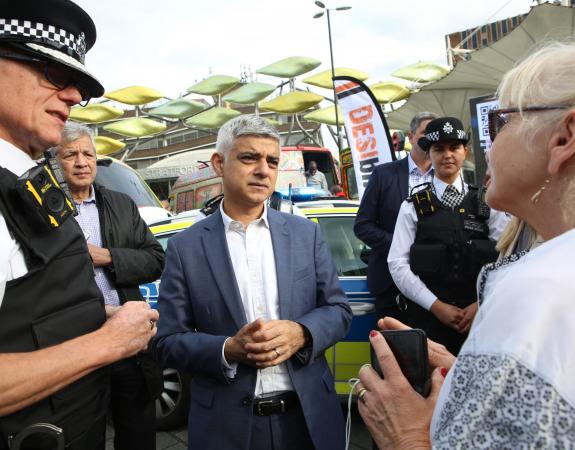 Mayor Sadiq Khan and Met Police Commissioner Sir Mark Rowley speaking to a member of the public on a community visit