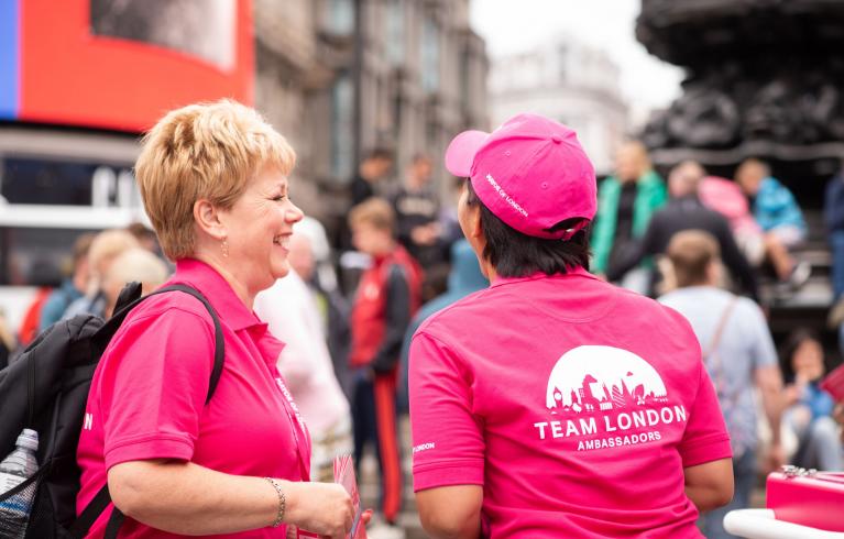 Team London ambassadors wearing pink t-shirts and supporting at event
