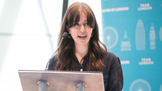Woman presenting at Team London Young Ambassadors summit