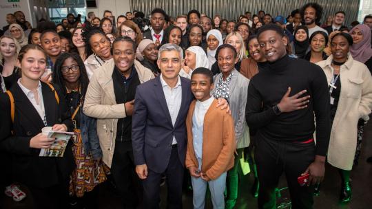 Sadiq Khan and young people posing for picture at YPAG event