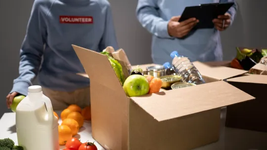 People volunteering at food bank