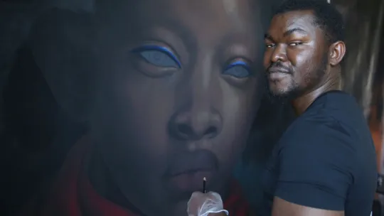 Artist painting a graffiti