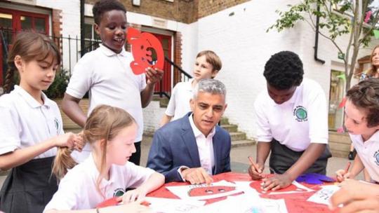 Sadiq Khan visits a primary school and sits down with children to work
