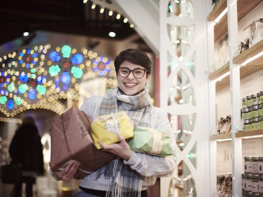 Christmas Eataly lady holding gifts