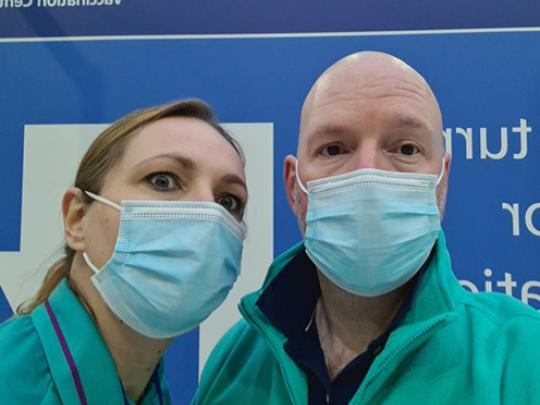 A photo of two vaccination centre volunteer
