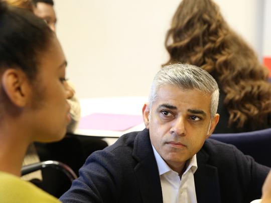 Mayor Sadiq Khan speaks with young people at a workshop