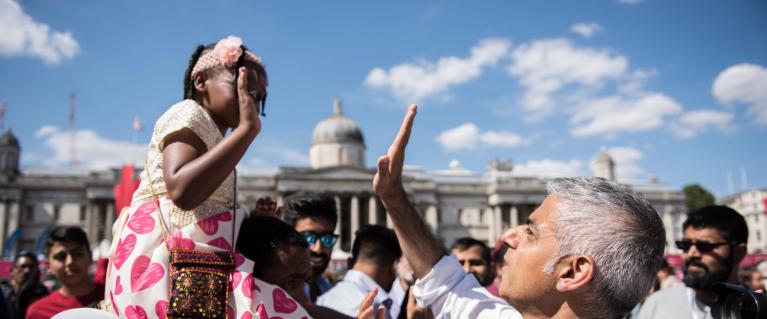 Sadiq Khan giving a high five to a little girl at Eid in Trafalgar Square