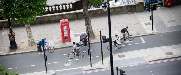 People cycling on London street