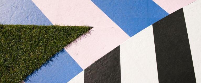 Grass and colourful concreate come together in a zig zag pattern