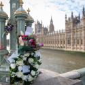 Floral tributes on Westminster Bridge with the Palace of Westminster in the background