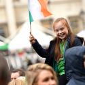 Girl holding the Irish flag on St Patrick's Day in Trafalgar Square