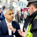 Mayor of London Sadiq Khan speaks with a police officer at Liverpool Street station