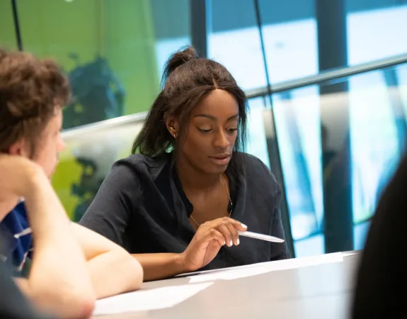 Woman reading document during a meeting