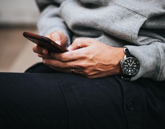 Person browsing on mobile phone