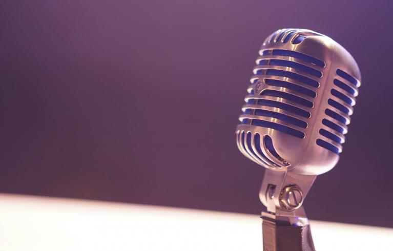 Microphone on purple background