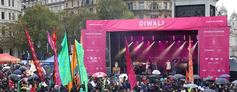 Main stage for Diwali on the Square, with crowd in front of it.