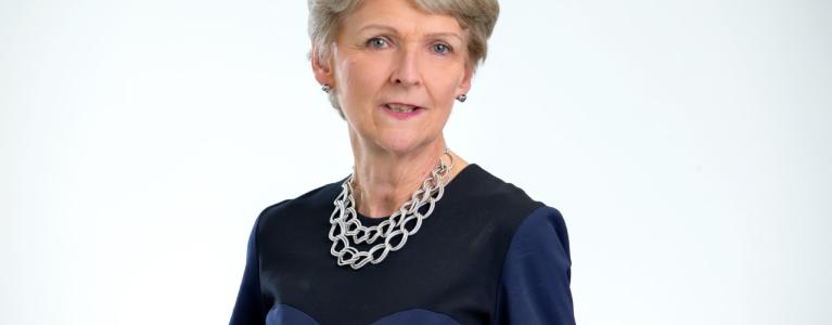 Headshot of woman in front of white background