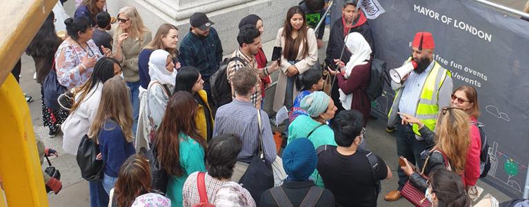 Abdull Maalik Tailor talking to people during tour