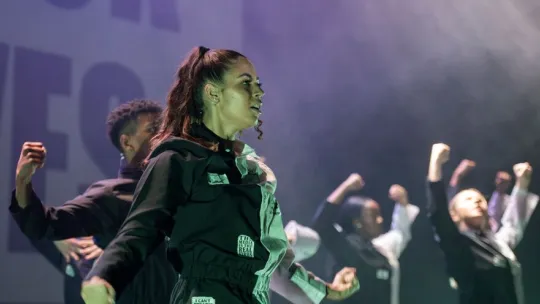 Young people performing at a dance show