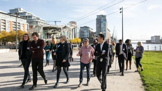 Infrastructure Advisory Panel walking in front of City Hall, Royal Victoria Docks