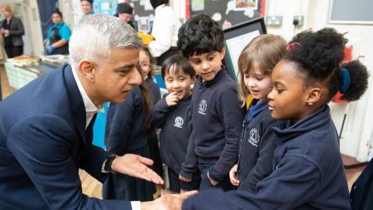 Mayor of London, Sadiq Khan, in a London school with young students.