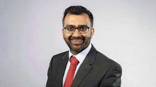 A headshot of Krupesh Hirani AM