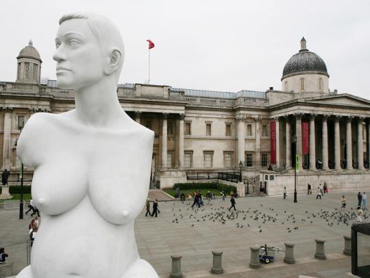 Statue of the artist Alison Lapper int he foreground, with the National Gallery in the background