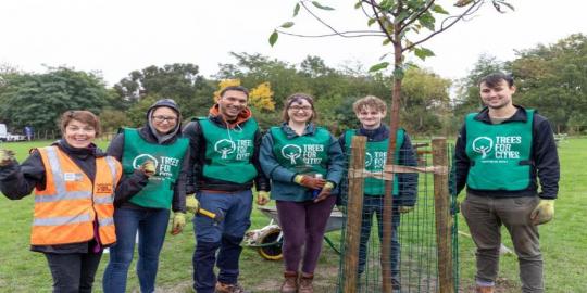 Jollys green environment with people standing together 