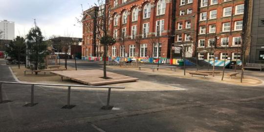 Street with school building urban play area 