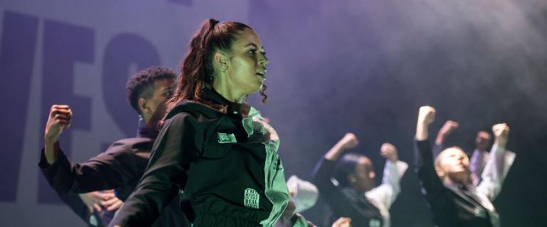 Young people performing at a dance show