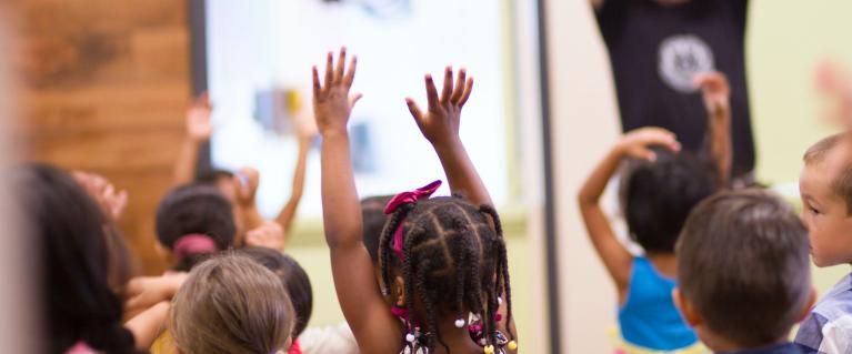 Children lifting hands