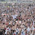 Crowds of fans with England shirts on at a football match
