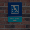 blue badge on wall