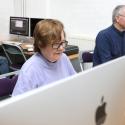 Picture of adults learning skills on a computer