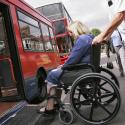 A wheelchair user accessing a bus