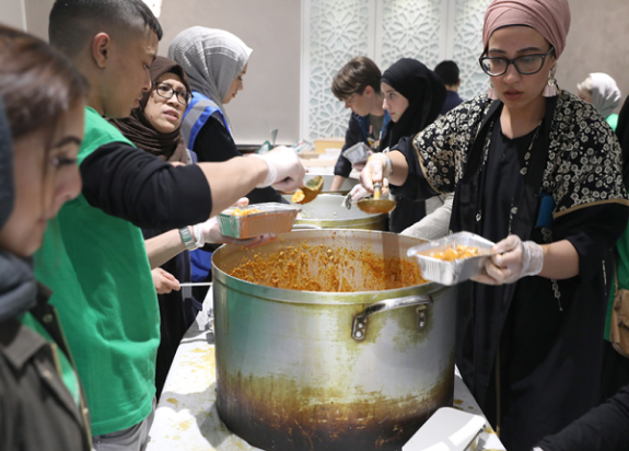 Volunteers serving food