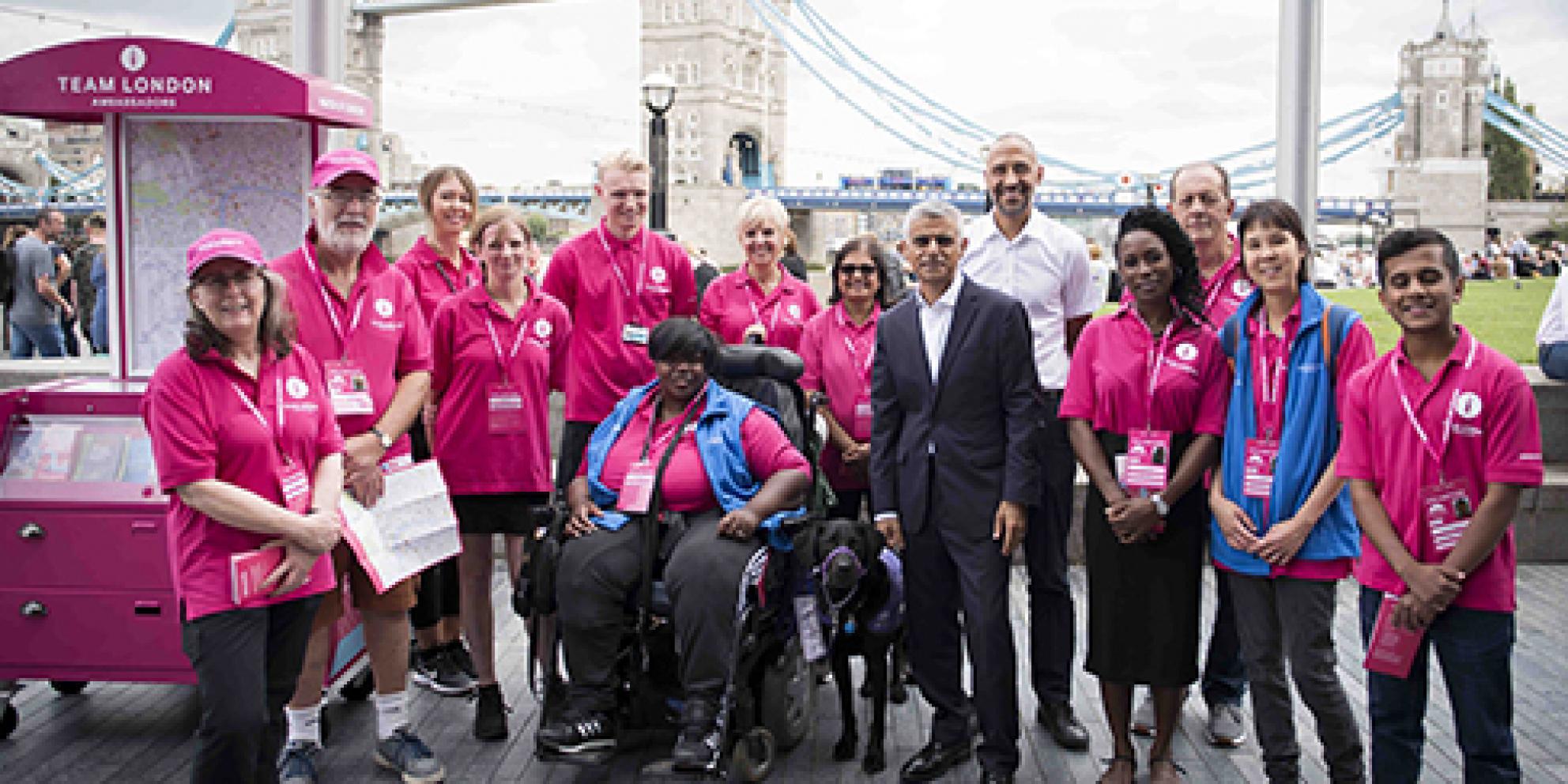 The Mayor Sadiq Khan surrounded by the Team London Ambassadors